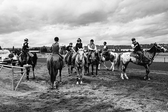 Warm-up assistants await the race horses at Emerald Downs. Aubur