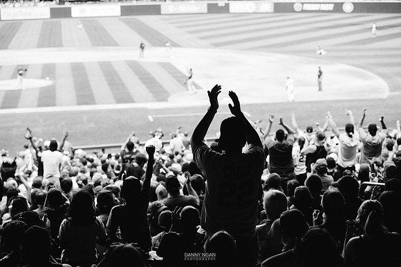 Fans cheer after Cano's RBI.